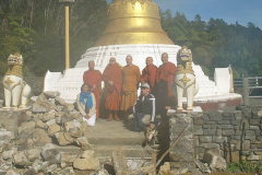 Visiting Burmese monks drop by to inspect progress on the stupa.