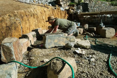 The south side of the stupa forecourt. Simon hard at work. Those stones are not small.
