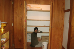 The old book store cupboard - now the bedding store. Lindsay rebuilds the shelves to suit.