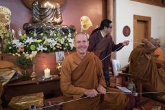 Setting up for the Paritta chanting. Ajahn looks happy.