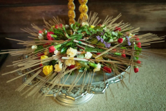 Flowers candles and incense being prepared for the circumambulation of the stupa.