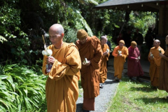 The Sangha leads the procession from the sala up to the stupa.