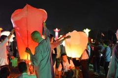 Hot air balloons being prepared. The sky was dotted with light.