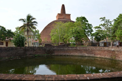 The large water tank in front of the central stupa.