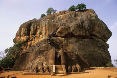 This level area is about half way up the rock. There was a massive lion enclosing the entrance. Only the paws remain.