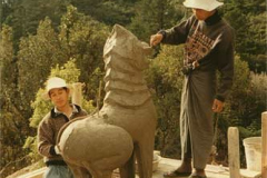 The Burmese craftsmen working on the entry lions.