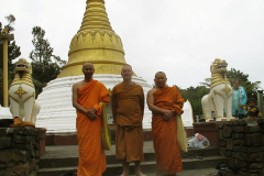 Visiting monks. The stupa is a very popular attraction.