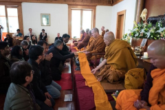 The Palmerston North Group offer the vassa forest cloth to the Sangha. [see the Kathina Gallery]