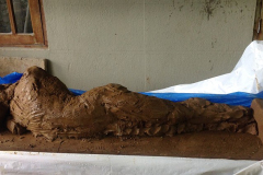 The clay model which will become the reclining Buddha rupa in the memorial grove.