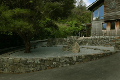 The final placement of the central stones and raking of the gravel sees the kitchen garden looking resplendent.