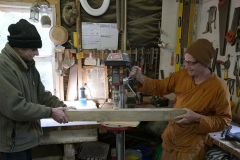Ajahn Kusalo and Lindsay working on the posts for the stupa safety rail. A boring job :)