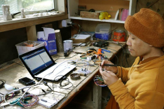 Ajahn Dta working on the new dhamma hall lighting controller.
