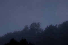 A crescent moon hangs over the Eastern hills.
