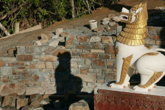 The south wall of the stupa forecourt. Light and shadow.