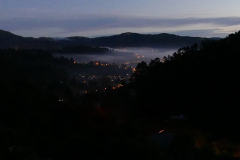 Looking down Stokes Valley from the monastery. The rectangle of light bottom is our dana sala skylight.