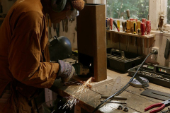 Ajahn Dta in metal-man mode working on the new donation box.