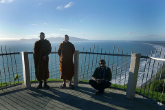Ajahn Dta and Kusalo enjoy the view of the Kapiti coast on the way to Palmerston North with Indranath.