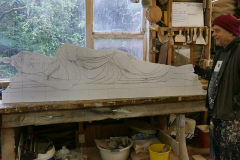 Bruce with a plywood model of the reclining Buddha rupa; the marble reality to be installed on the west-side of the stupa.