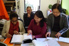 Sachini (left) giving guidance to the financial team (Christina Irene & Hwa). The photo is a bit out of focus but they are all very focussed.
