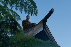 Ajahn Kusalo repairing his kuti stove chimney.