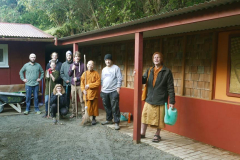 Venerable Kusalacitto led a group of guests in cleaning around the Chao Khun kuti. The courtyard has been releveled along with access tracks.