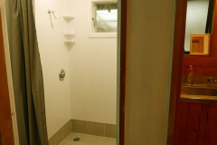 One of the new shower stalls with a 2nd stall to the left next to the new bathroom. A far better use of the old space.