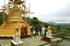 The first coat of paint on the stupa base. Not the best weather - but good enough.