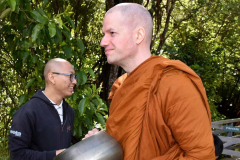 Venerable Phasuko quietly waits in the pindapat line.