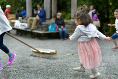 Raking the courtyard gravel adds to the playground fun.