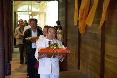 Uncle Som carries the Kathina cloth and leads the laity in procession three times around the sala.