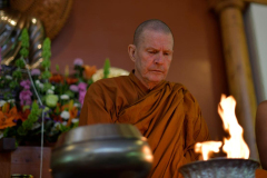 The names of deceased family members are burned while the Sangha chants Anicca vata sankhara...