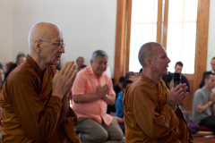 Ajahns Viradhammo and Kusalo add their voices to the chanting.