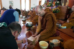 Ajahn Kevali receiving offerings.