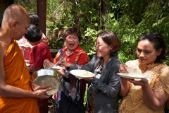 Ajahn Natawat receiving alms.