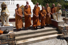The stone is down and the Sangha looks on.