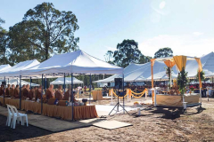 The tents form roughly the outline of the new dhamma hall. The shrine center-right is approximately where the final shrine will be.