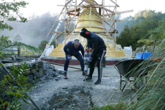 Craig and Felix hard at work breaking up the concrete slab where the reclining buddha rupa will go.