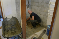 Bruce working wonders in the downstairs bhikkhu vihara bathroom.