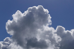 A winter cloud against a bright spring sky.