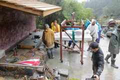 Almost there. A platform is being built to slide the rupa in under the roof onto the base.