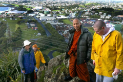 The Paritutu rock summit has been reached. New Plymouth in behind.