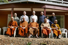 The Bodhinyanarama vassa group (plus Ajahn Hasapannyo) in front of the newly renovated Garden and Lotus kutis under the Raja. A post-vassa tea gathering.