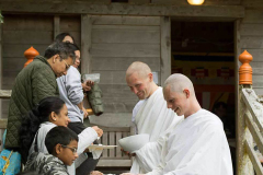 Anagarikas receiving alms food.
