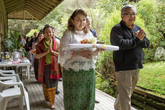 The procession around the sala with Khun Siriwam carrying the forest cloth to be offered.