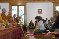 Khun Siriwam dedicates the offering of forest cloth to the sangha.