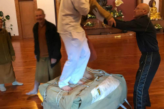 Getting the marquee back in the bag is always a creative dance. Bryce and Ajahn Joe are applying their persuasive feet to the job - with Jet as a stabilising hand.
