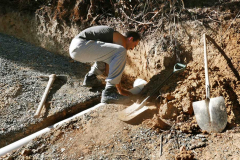 Beat working on redirecting the water away from the top of the landslide.