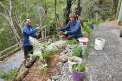 Paul and Beat tidying up around the edges of the new wheel-access track at the bhikkhu vihara.