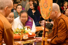 Kathina: the cloth is offered to the sangha.