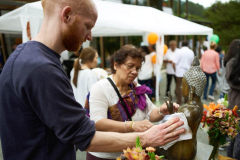 Stupa dedication: the sitting buddha rupa gets a polish.